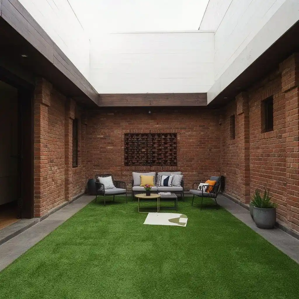 Modern Bulawayo townhouse courtyard with lush artificial grass creating a clean, green, low-maintenance outdoor living space.